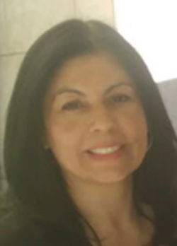 Woman with medium length dark hair smiling
